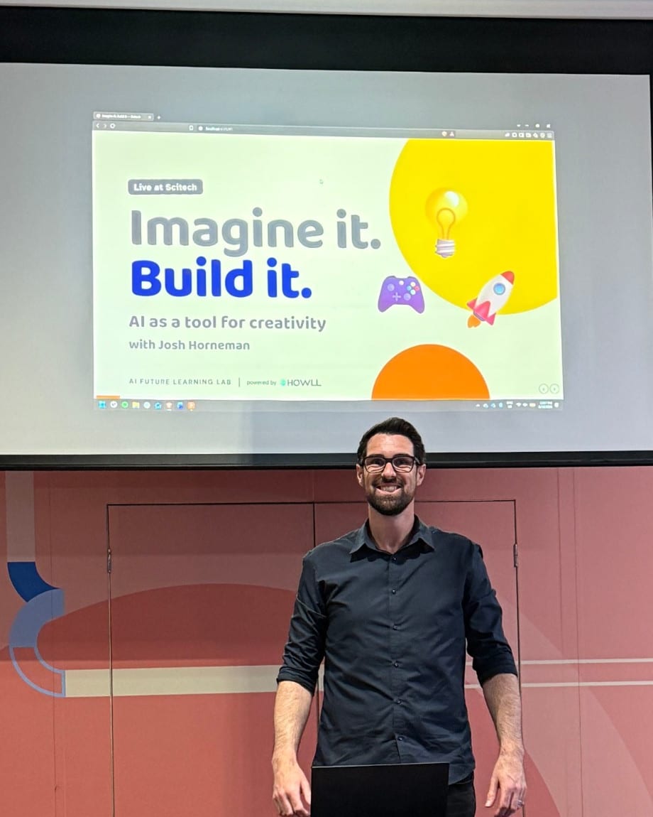 Our presenter in front of the opening slide of Imagine it. Build it., a session on AI as a tool for creativity